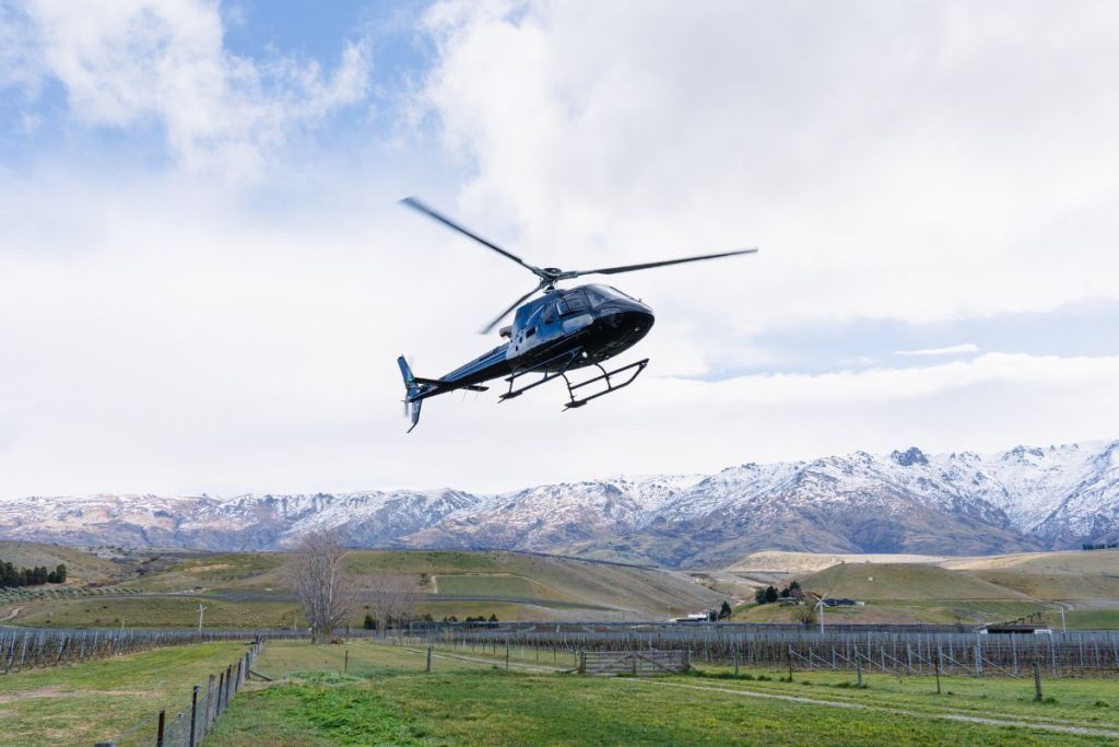 helicopter in flight queenstown custom  tours